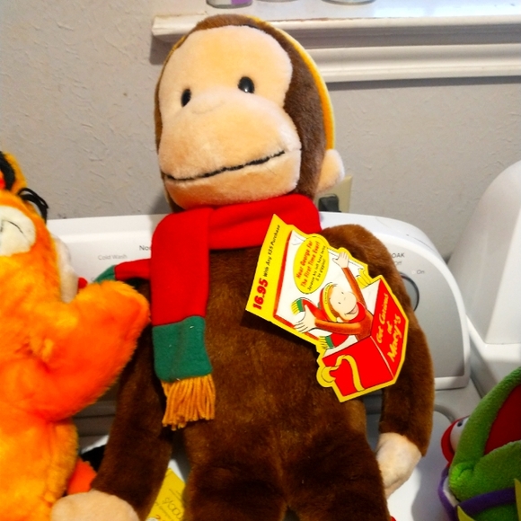 Macy's collection of curious George and Kermit the frog